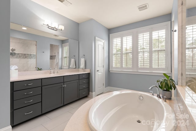 bathroom with vanity, plus walk in shower, tile patterned floors, and plenty of natural light