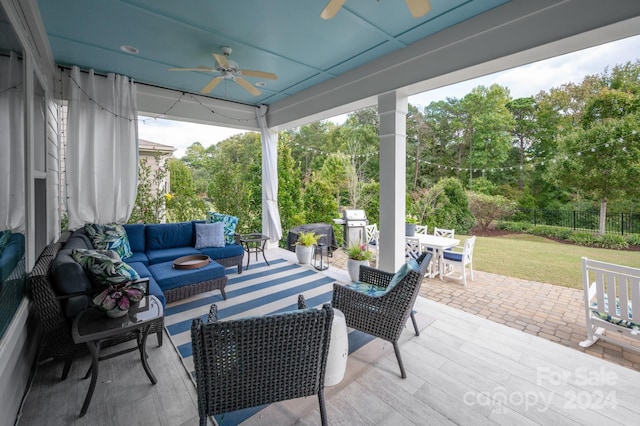 view of patio / terrace featuring an outdoor living space and ceiling fan