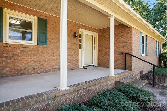 property entrance with covered porch