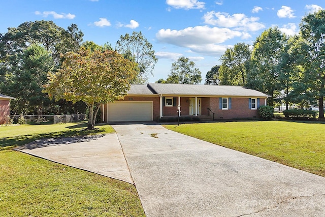 single story home featuring a front lawn and a garage