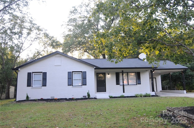 single story home with a front yard and a carport