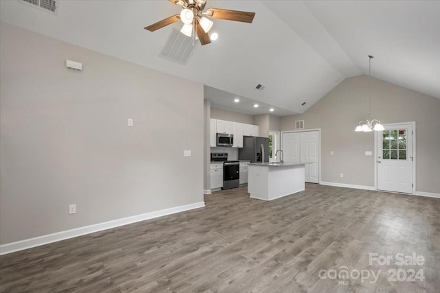 unfurnished living room featuring ceiling fan with notable chandelier, high vaulted ceiling, hardwood / wood-style flooring, and sink