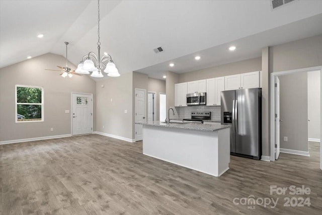 kitchen with hardwood / wood-style flooring, a kitchen island with sink, stainless steel appliances, and white cabinets