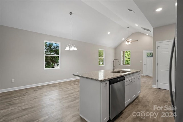 kitchen with an island with sink, plenty of natural light, sink, and stainless steel appliances