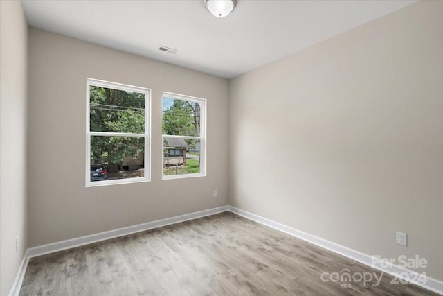 unfurnished room featuring light wood-type flooring