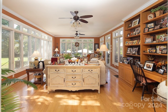 sunroom featuring ceiling fan