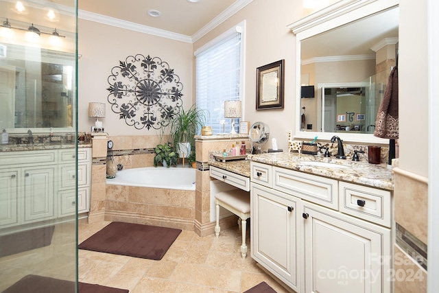 bathroom with vanity, ornamental molding, and tiled tub