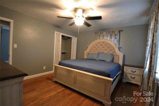 bedroom featuring dark wood-type flooring and ceiling fan