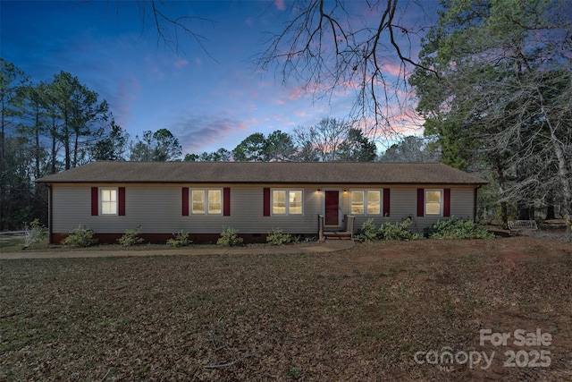 single story home featuring crawl space and a lawn