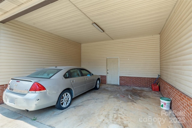 garage featuring an attached carport