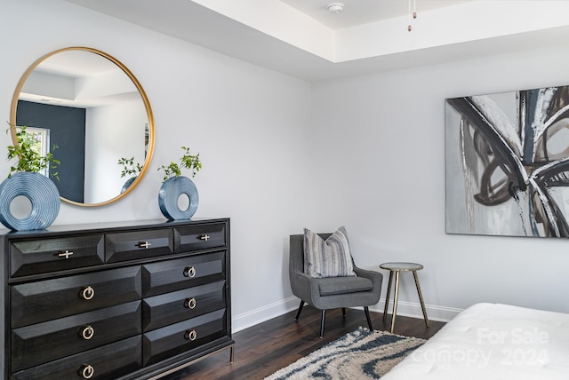 bedroom with dark hardwood / wood-style flooring