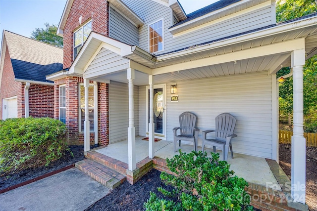 property entrance featuring covered porch