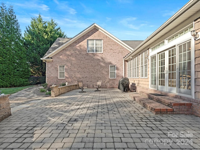 back of house with a patio and french doors