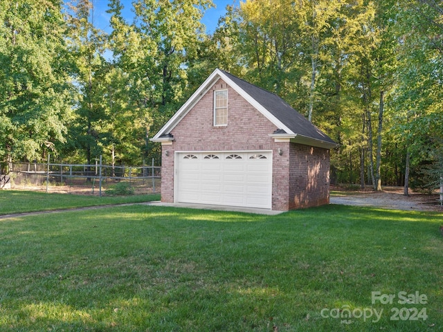 garage featuring a yard