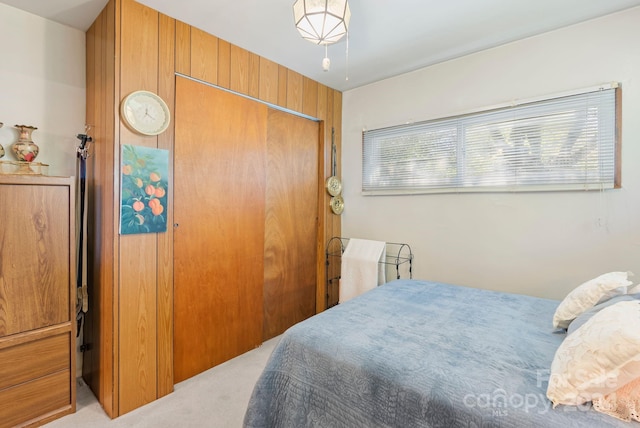 carpeted bedroom featuring a closet