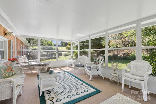 sunroom / solarium featuring a healthy amount of sunlight