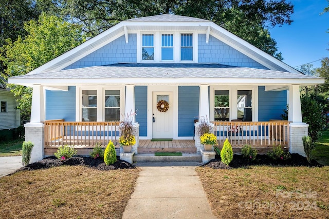 bungalow-style house featuring covered porch