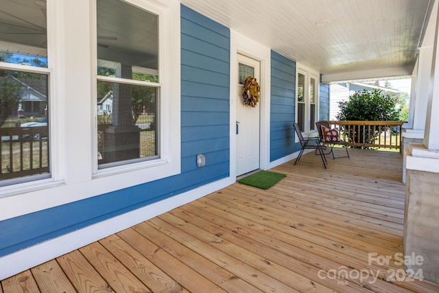 wooden terrace with covered porch