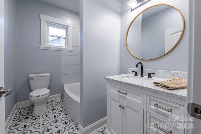 bathroom featuring vanity, a bathing tub, toilet, and tile patterned floors