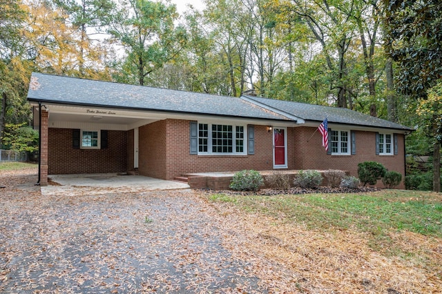 single story home featuring a carport