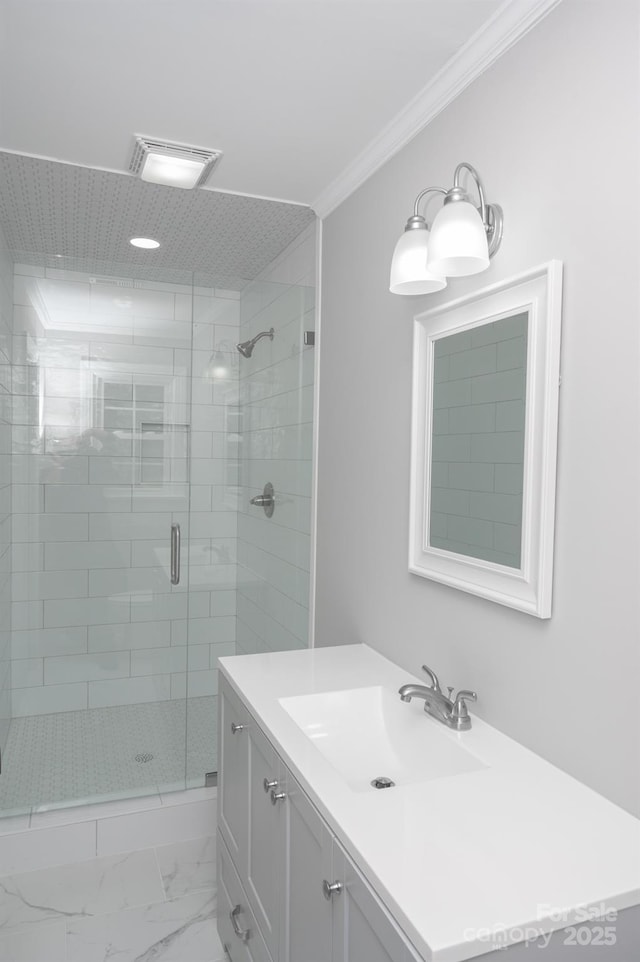 bathroom with crown molding, vanity, and an enclosed shower