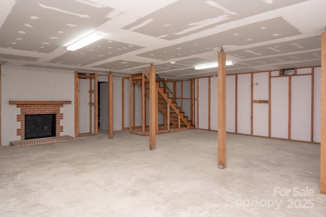 basement with a brick fireplace