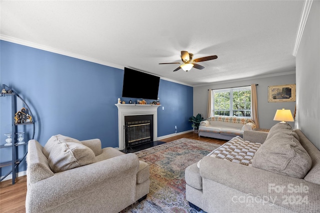 living room with crown molding, hardwood / wood-style flooring, and ceiling fan