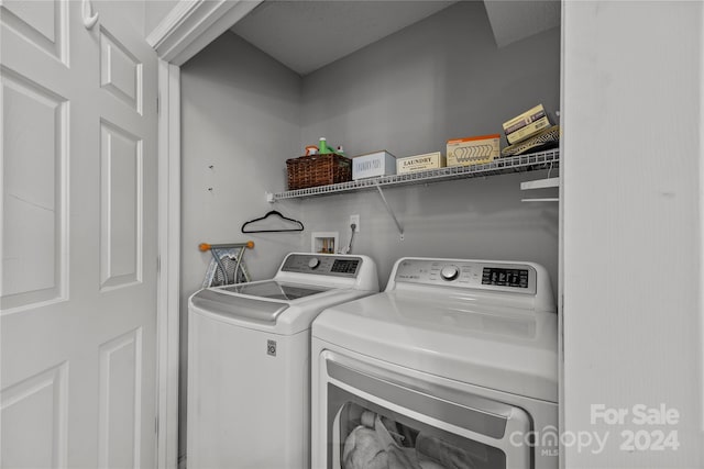 laundry area with washing machine and dryer