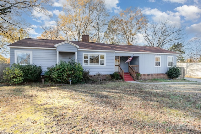 ranch-style house featuring a front yard