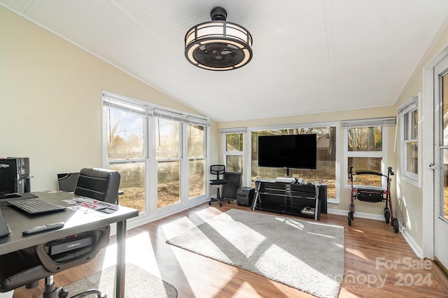 sunroom / solarium with vaulted ceiling