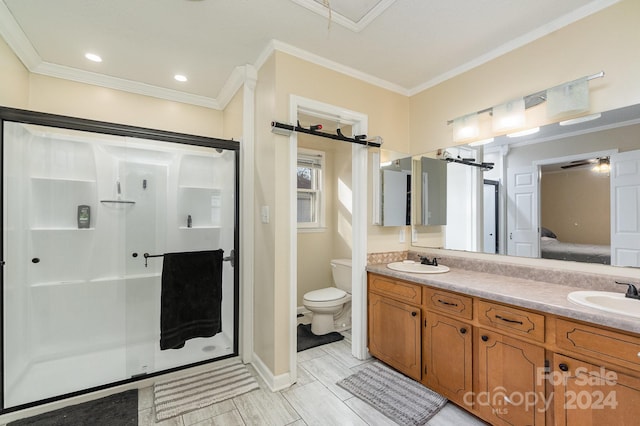 bathroom with vanity, toilet, walk in shower, and ornamental molding