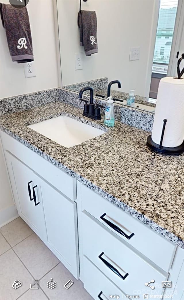 bathroom featuring vanity and tile patterned flooring