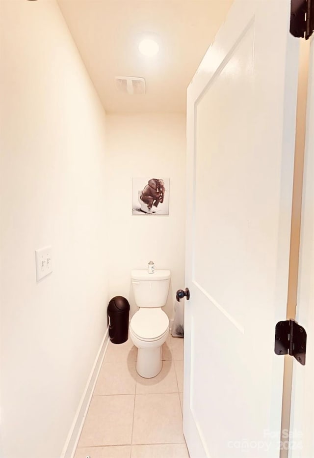 bathroom featuring toilet and tile patterned floors