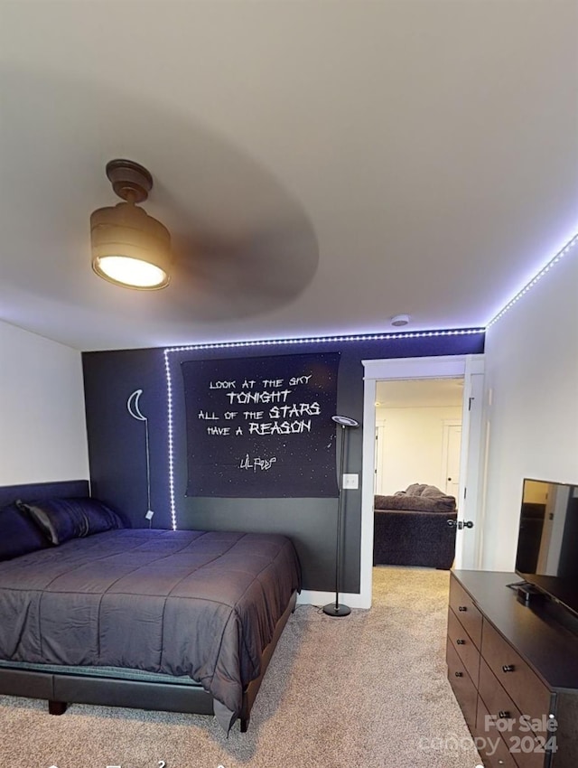 bedroom featuring light colored carpet