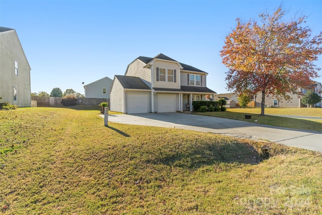 view of front of home featuring a front yard and a garage