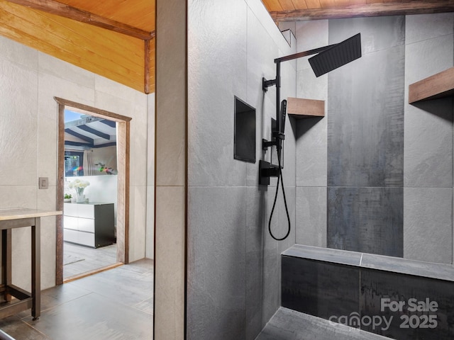 full bathroom featuring tile walls and a walk in shower