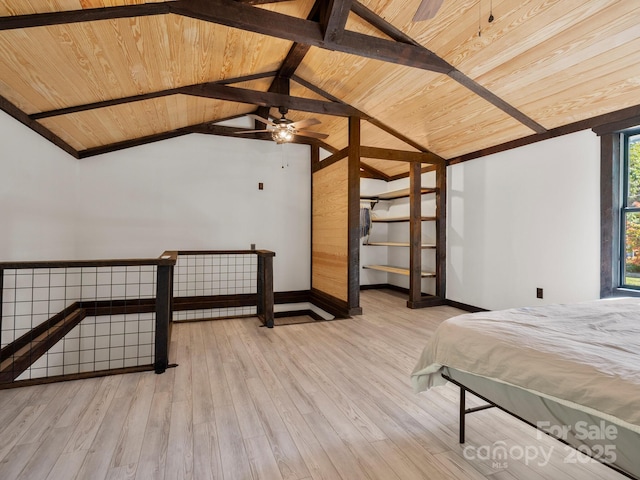 unfurnished bedroom featuring lofted ceiling with beams, baseboards, wood ceiling, and wood finished floors