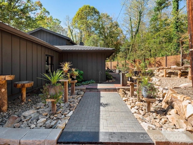 view of patio featuring fence