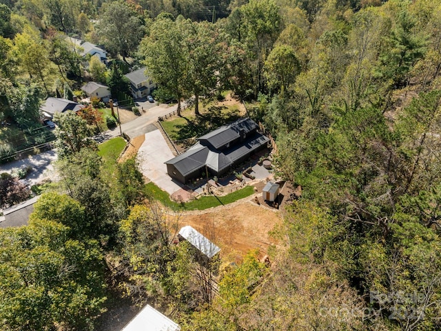 aerial view with a wooded view