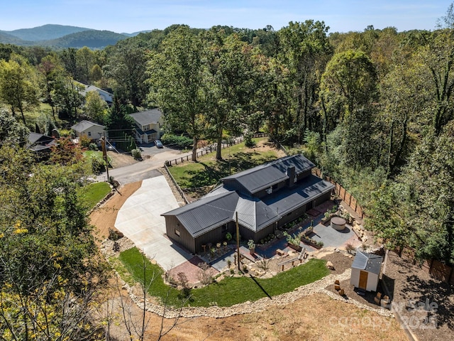 bird's eye view featuring a forest view