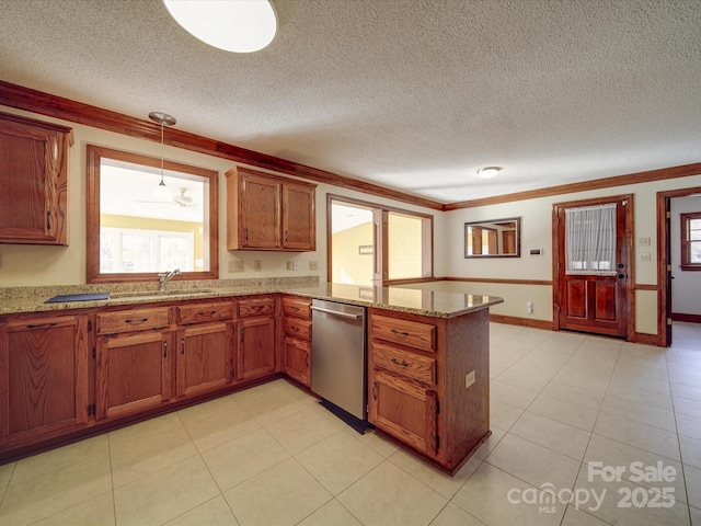 kitchen with sink, crown molding, hanging light fixtures, stainless steel dishwasher, and kitchen peninsula