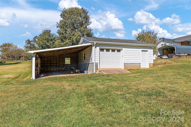 garage featuring a lawn and a carport