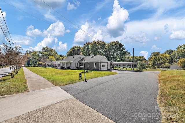 single story home with a front yard