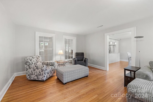 living room with light hardwood / wood-style flooring