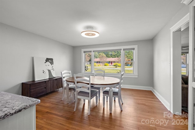 dining room with light wood-type flooring