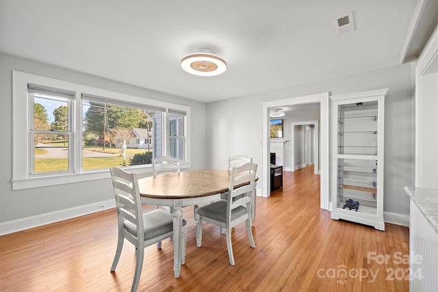 dining area with light hardwood / wood-style floors