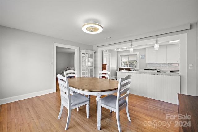 dining area with light hardwood / wood-style flooring