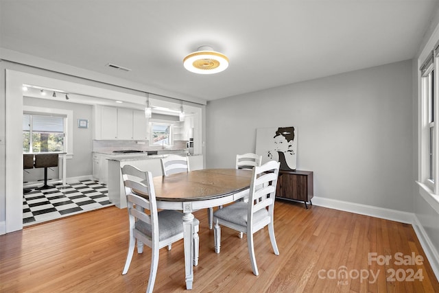 dining room with light hardwood / wood-style floors