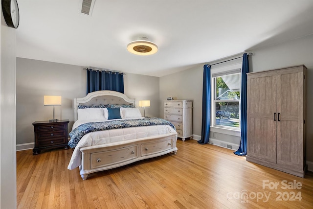 bedroom with light hardwood / wood-style floors