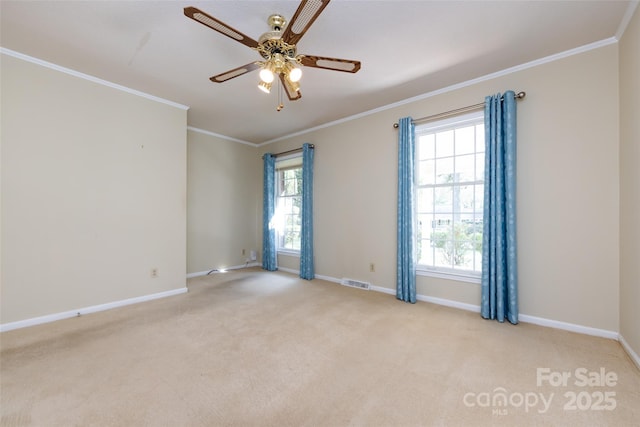 unfurnished room with light carpet, baseboards, visible vents, ceiling fan, and ornamental molding